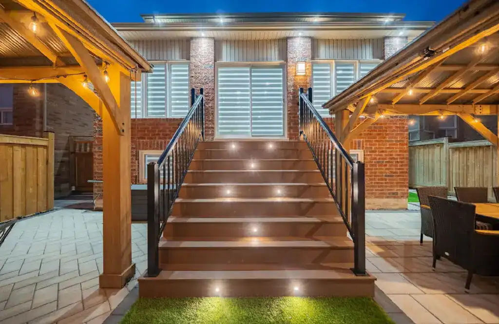 Outdoor staircase with integrated LED lighting, enhancing safety and aesthetics for landscaping projects.