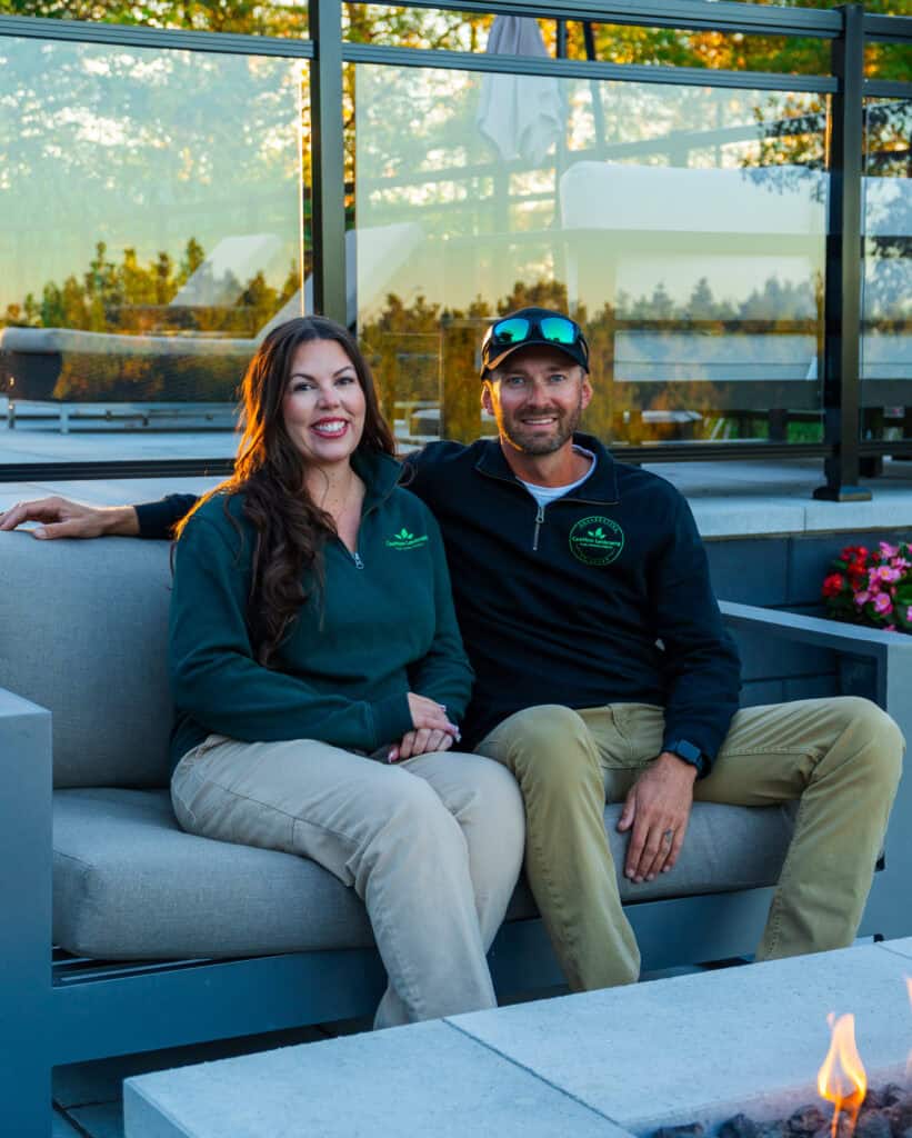 Bright outdoor patio with modern furniture and firepit, landscaping team from Caremore Landscaping.